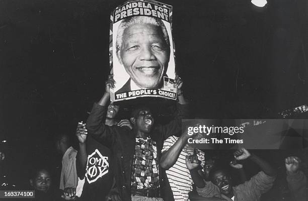 Crowd holding a poster with 'Mandela for President' written on it on May 2, 1994 in South Africa.