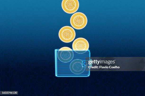 saving cryptocurrency coins into secure digital wallet - digital wallet concept stock pictures, royalty-free photos & images