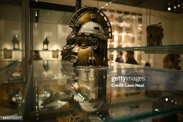 Items from a collection of metal plaques and sculptures taken from modern-day Nigeria in 1897, commonly referred to as the Benin Bronzes, are seen in...