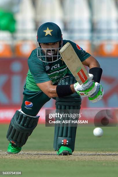 Pakistan's Mohammad Rizwan plays a shot during the Asia Cup 2023 cricket match between Pakistan and Nepal at the Multan Cricket Stadium in Multan on...