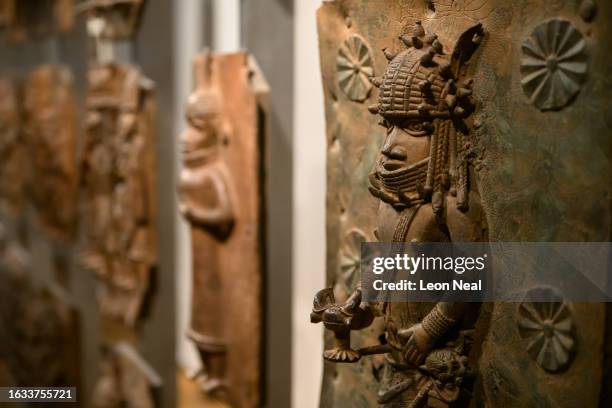 Items from a collection of metal plaques and sculptures taken from modern-day Nigeria in 1897, commonly referred to as the Benin Bronzes, are seen in...