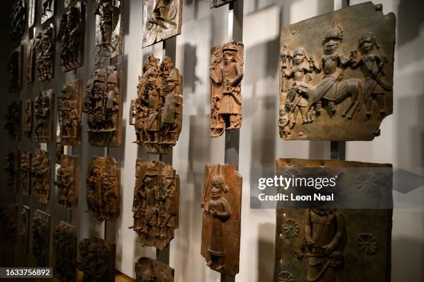 Items from a collection of metal plaques and sculptures taken from modern-day Nigeria in 1897, commonly referred to as the Benin Bronzes, are seen in...