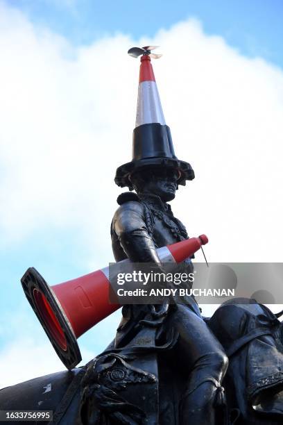 The Duke of Wellington statue is seen with a new cone on its head and another under its arm outside the Gallery of Modern Art in Glasgow on August 30...