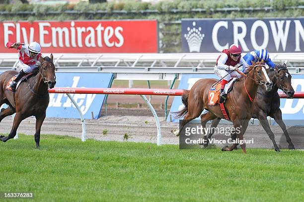 Craig WIlliams riding Montsegur races to win from Steven Arnold riding Bulbula in the TBV Thoroughbred Breeders Stakes during Super Saturday at...