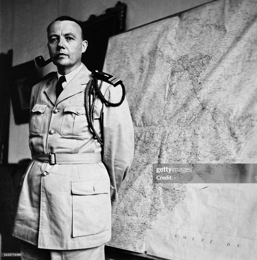 Colonel Conchie Colonel Louis Constans poses in front of a map of the Gulf of Tonkin ...