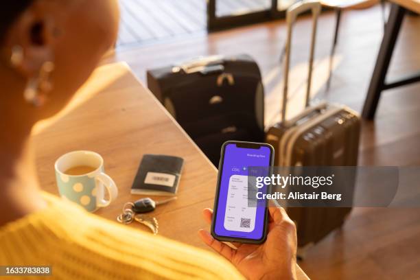 woman preparing to travel by plane - sorting belongings stock pictures, royalty-free photos & images