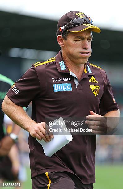 Hawthorn Hawks coach Alastair Clarkson walks out after his half time address during the round three NAB Cup AFL match between the Hawthorn Hawks and...