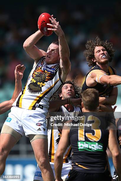 Jarryd Roughead of the Hawthorn Hawks marks the ball against Ty Vickery of the Richmond Tigers during the round three NAB Cup AFL match between the...