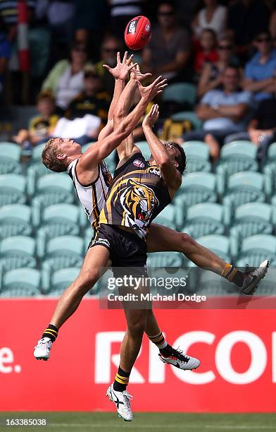 Jed Anderson of the Hawthorn Hawks contests for the ball against Alex Rance of the Richmond Tigers during the round three NAB Cup AFL match between...