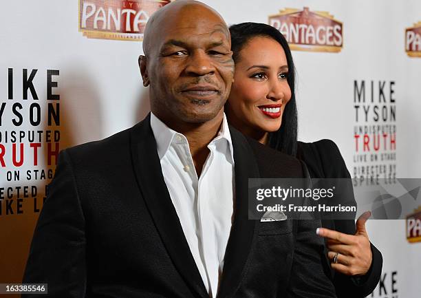 Mike Tyson with his wife Kiki Tyson arrive at the opening Night Of "Mike Tyson: Undisputed Truth" At The Pantages Theatre at the Pantages Theatre on...