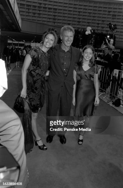 Wendy Crewson, Harrison Ford, and Liesel Matthews attend the local premiere of "Air Force One" at the Cineplex Odeon Century Plaza Cinemas in the...