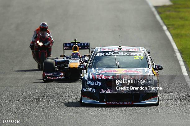Jamie Whincup of Red Bull Racing Australia Holden, Mark Webber of Australia and Infiniti Red Bull Racing and Casey Stoner of Red Bull Pirtek Holden...