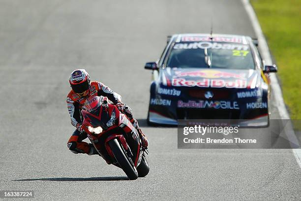 Casey Stoner of Red Bull Pirtek Holden and Jamie Whincup of Red Bull Racing Australia Holden drive during the Top Gear Festival at Sydney Motorsport...