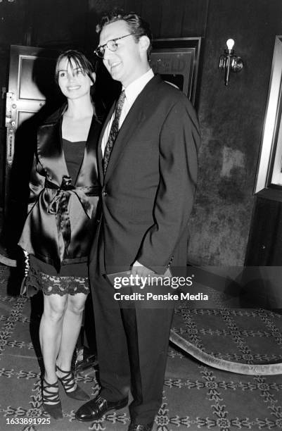 Karen Duffy and John Lambros attend the local premiere of "The Peacemaker" at the Ziegfeld Theatre in New York City on September 22, 1997.