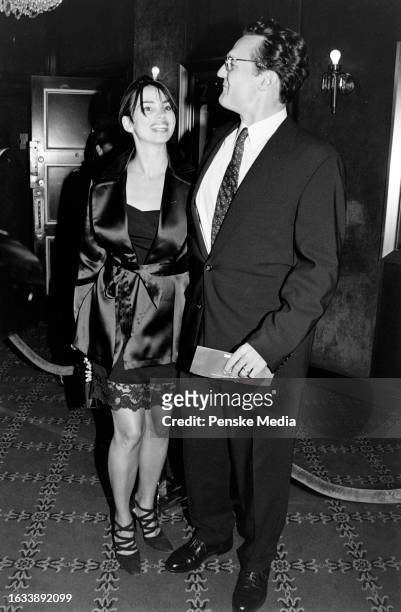 Karen Duffy and John Lambros attend the local premiere of "The Peacemaker" at the Ziegfeld Theatre in New York City on September 22, 1997.