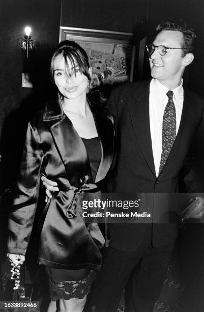 Karen Duffy and John Lambros attend the local premiere of "The Peacemaker" at the Ziegfeld Theatre in New York City on September 22, 1997.