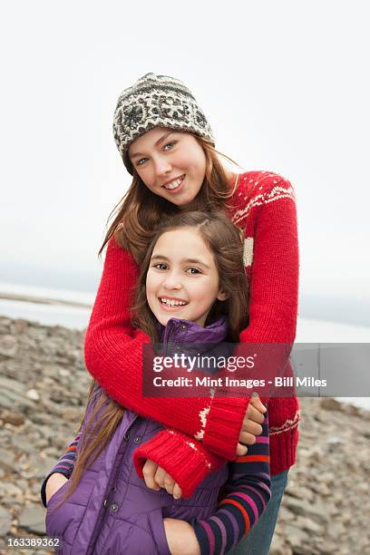 a day out at ashokan lake. two girls hugging and looking at the camera. - ashokan reservoir stock pictures, royalty-free photos & images