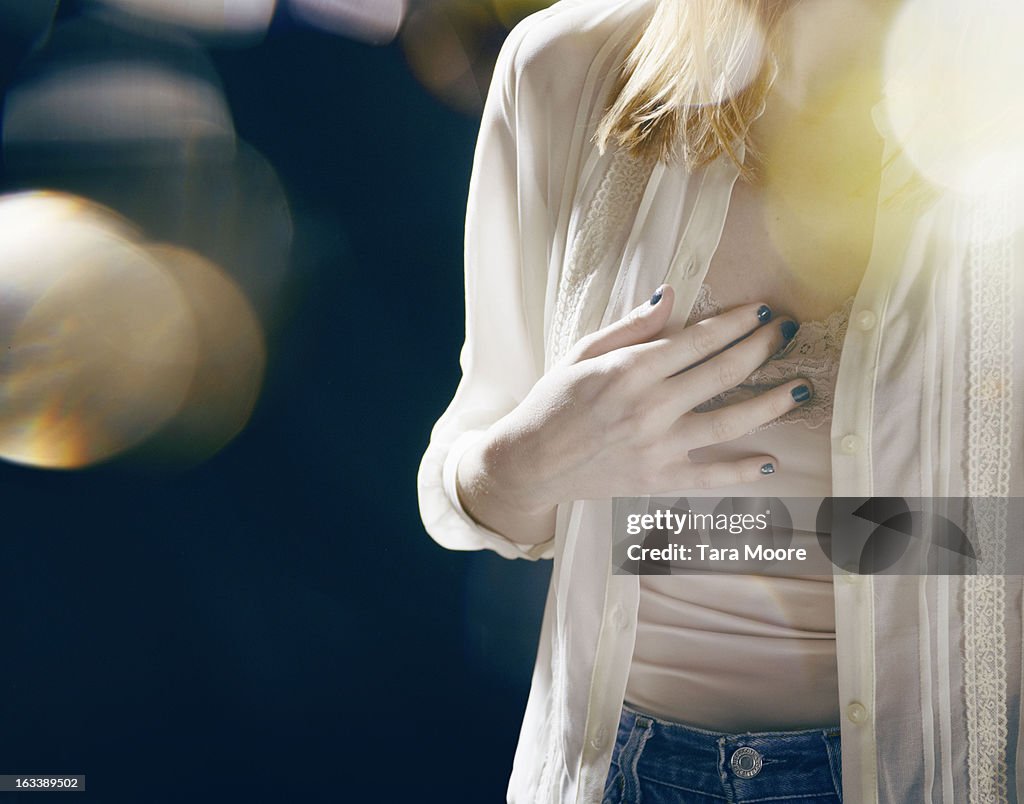 Woman touching her heart