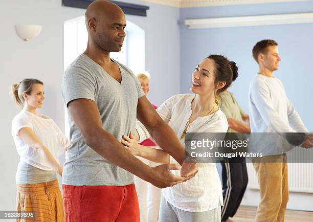 teacher and students in exercise class. - teenage girl tai chi stock pictures, royalty-free photos & images