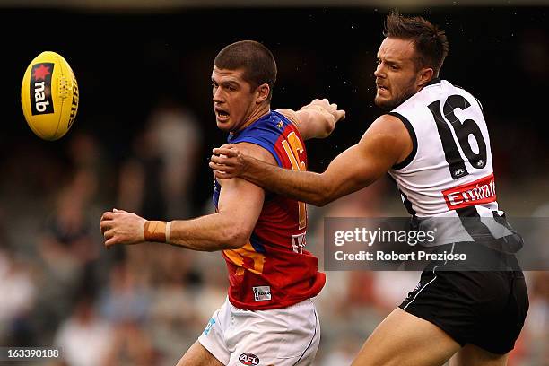 Jonathan Brown of the Lions and Nathan Brown of the Magpies contest the ball during the round three NAB Cup AFL match between the Collingwood Magpies...