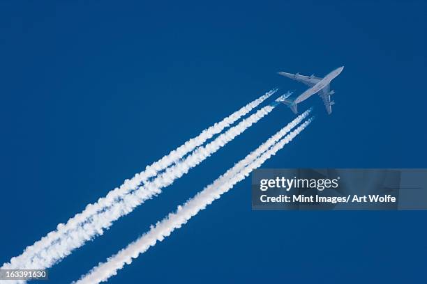 jet plane in flight, alaska, usa - vapour trail stock pictures, royalty-free photos & images