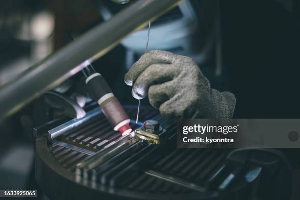 man welding in factory - ship on fire stock pictures, royalty-free photos & images