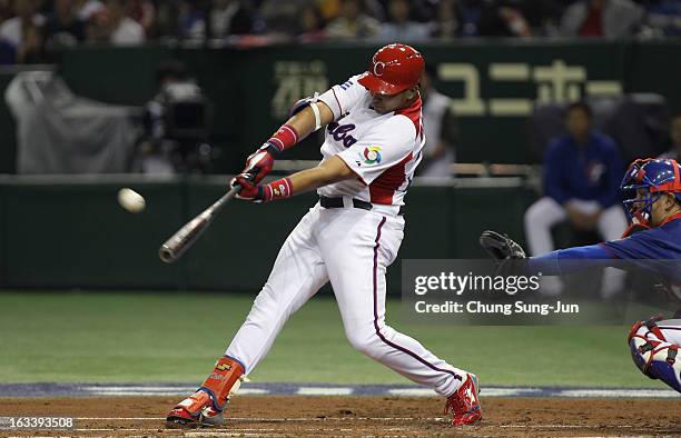 Frederich Cepeda of Cuba hits a two run home run bottom in the first inning during the World Baseball Classic Second Round Pool 1 game between...