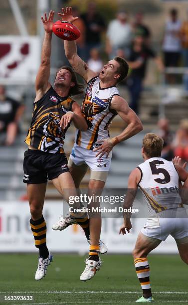 Max Bailey of the Hawthorn Hawks wins the tap out against Ivan Maric of the Richmond Tigers during the round three NAB Cup AFL match between the...