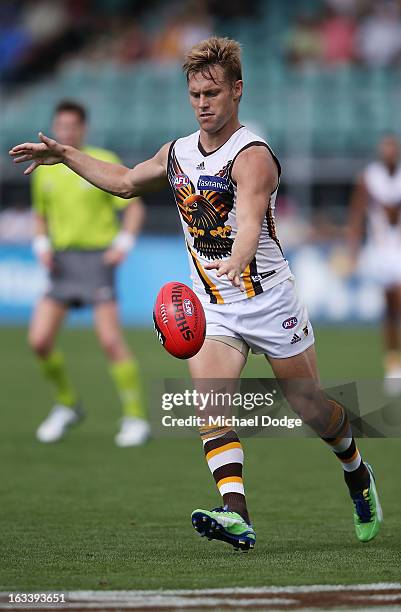 Sam Mitchell of the Hawthorn Hawks kicks the ball during the round three NAB Cup AFL match between the Hawthorn Hawks and the Richmond Tigers at...