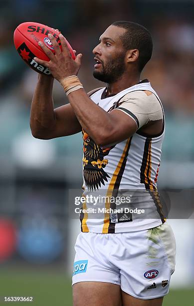Josh Gibson of the Hawthorn Hawks marks the ball during the round three NAB Cup AFL match between the Hawthorn Hawks and the Richmond Tigers at...