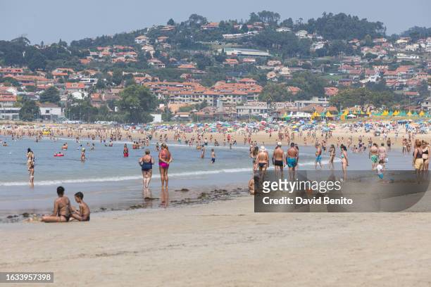 People come to swim and sunbathe on America Beach on August 23, 2023 in Vigo, Spain. A recent study places Vigo as the favorite city in Spain to...