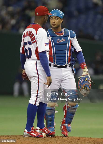 Pitcher Danny Betancourt, and catcher Frank Morejon of Cuba confer in the second inning during the World Baseball Classic Second Round Pool 1 game...