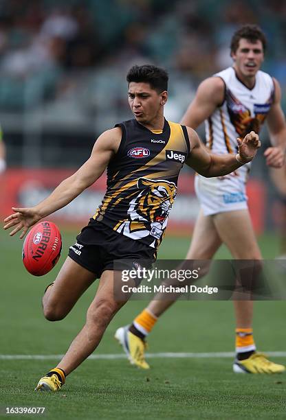 Robin Nahas of the Richmond Tigers kicks the ball during the round three NAB Cup AFL match between the Hawthorn Hawks and the Richmond Tigers at...