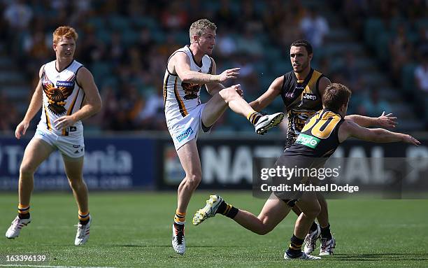 Xavier Ellis of the Hawthorn Hawks kicks the ball during the round three NAB Cup AFL match between the Hawthorn Hawks and the Richmond Tigers at...