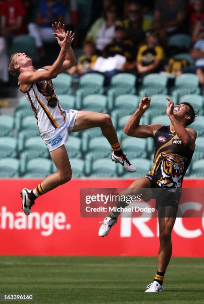 Jed Anderson of the Hawthorn Hawks contests for the ball against Alex Rance of the Richmond Tigers during the round three NAB Cup AFL match between...