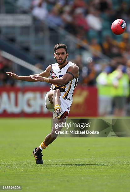 Derick Wanganeen of the Hawthorn Hawks kicks the ball during the round three NAB Cup AFL match between the Hawthorn Hawks and the Richmond Tigers at...