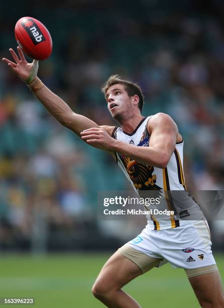 Ben Stratton of the Hawthorn Hawks marks the ball during the round three NAB Cup AFL match between the Hawthorn Hawks and the Richmond Tigers at...