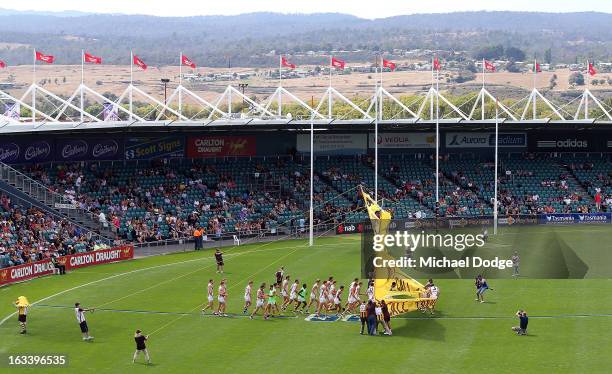 General view as the Hawthorn Hawks run through their banner before the round three NAB Cup AFL match between the Hawthorn Hawks and the Richmond...