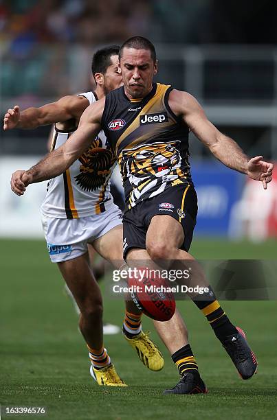 Troy Chaplin of the Richmond Tigers kicks the ball during the round three NAB Cup AFL match between the Hawthorn Hawks and the Richmond Tigers at...