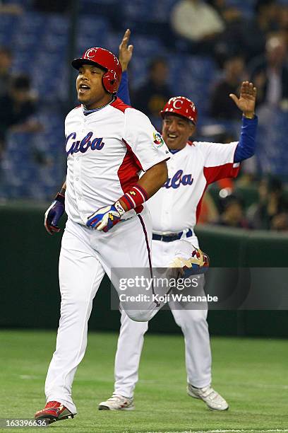 Outfielder Yasmany Tomas of Cuba celebrates after scoring hits a three run home run in the top half of the sixth inning during the World Baseball...