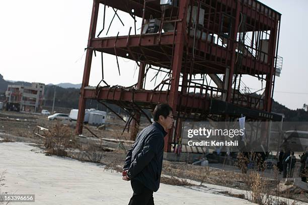 Man walks past ruins in the coastal town of Minamisanriku, that was 95 percent destroyed by the tsunami that followed the 2011 9.0 magnitude...