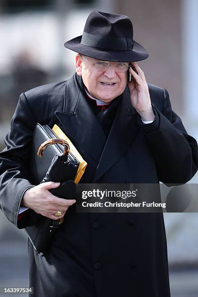 Cardinal Raymond Burke leaves a synod meeting as cardinals prepare to vote for a new pope on March 9, 2013 in Vatican City, Vatican. Cardinals are...