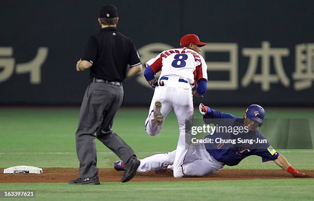 Jose Fernandez of Cuba forces out Dai-Kang Yang of Chinese Taipei as he slides into second base in the third inning during the World Baseball Classic...