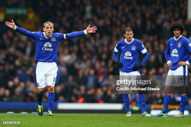 Phil Neville of Everton shows his frustration after his side concedes a second goal as Nikica Jelavic and Marouane Fellani look on during the FA Cup...