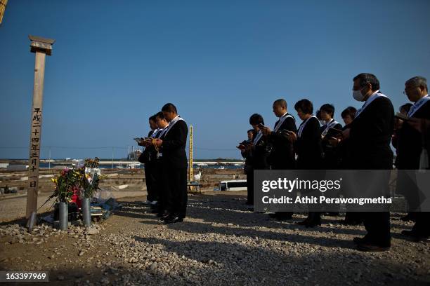People from Kanagawa Prefecture pay their respects prior to the second anniversary of the earthquake and tsunami on March 9, 2013 in Natori, Japan....