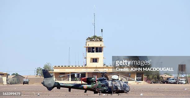 French Gazelle helicopter sits in front of the main terminal at the airport in Gao on March 9 where the French forces have established one of their...