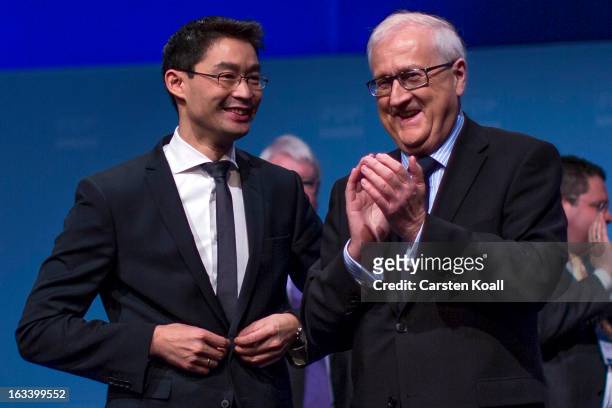 Rainer Bruederle , Bundestag faction leader of the German Free Democrats, applauds Philipp Roesler , German Economy Minister and Chairman of the...