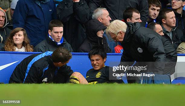 Ryo Miyaichi of Wigan is taken off injured during the FA Cup Sixth Round match between Everton and Wigan Athletic at Goodison Park on March 9, 2013...