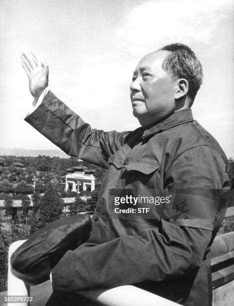 Chinese leader Mao Zedong reviewing for the first time the army forces of the "Great Proletarian Cultural Revolution" on the Tienanmen Gate rostrum...