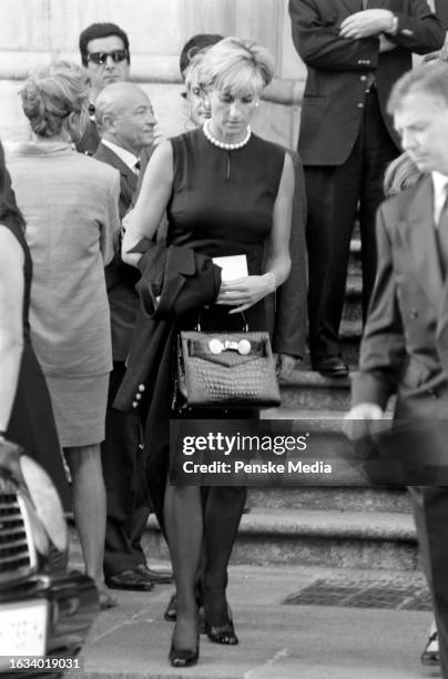 Mourners including Diana Spencer attend a memorial service for fashion designer Gianni Versace at the Duomo in Milan, Italy, on July 22, 1997.